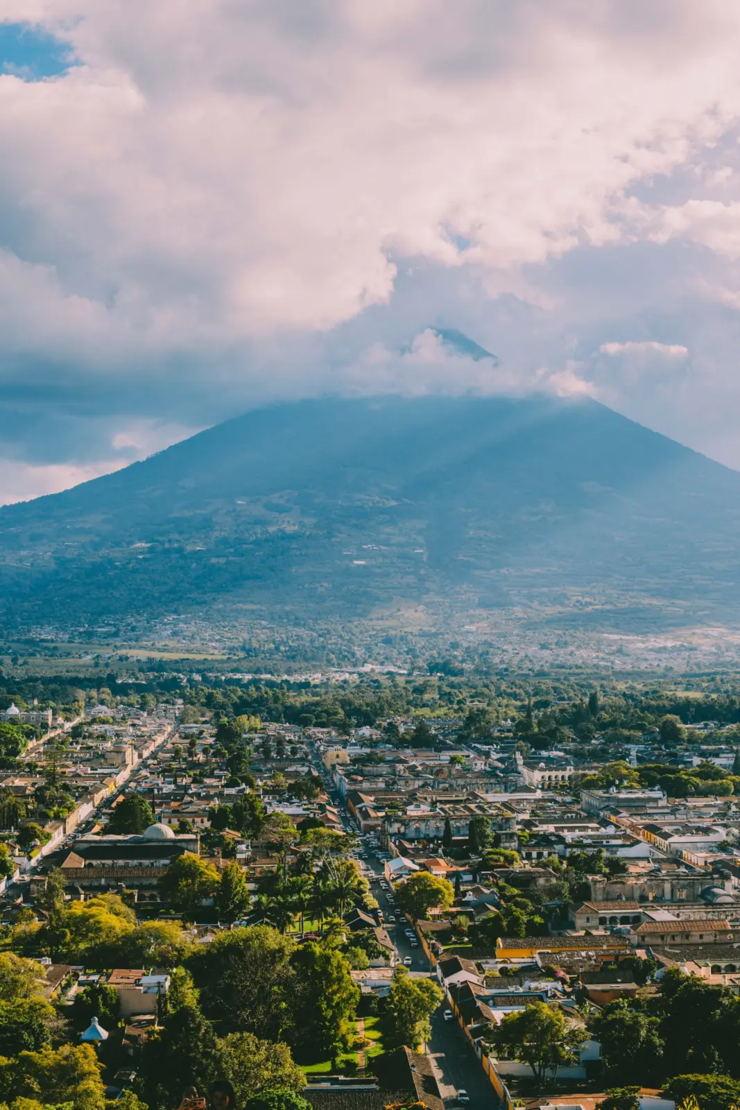 Antigua Guatemala beneath the cloud-covered Volcán de Agua