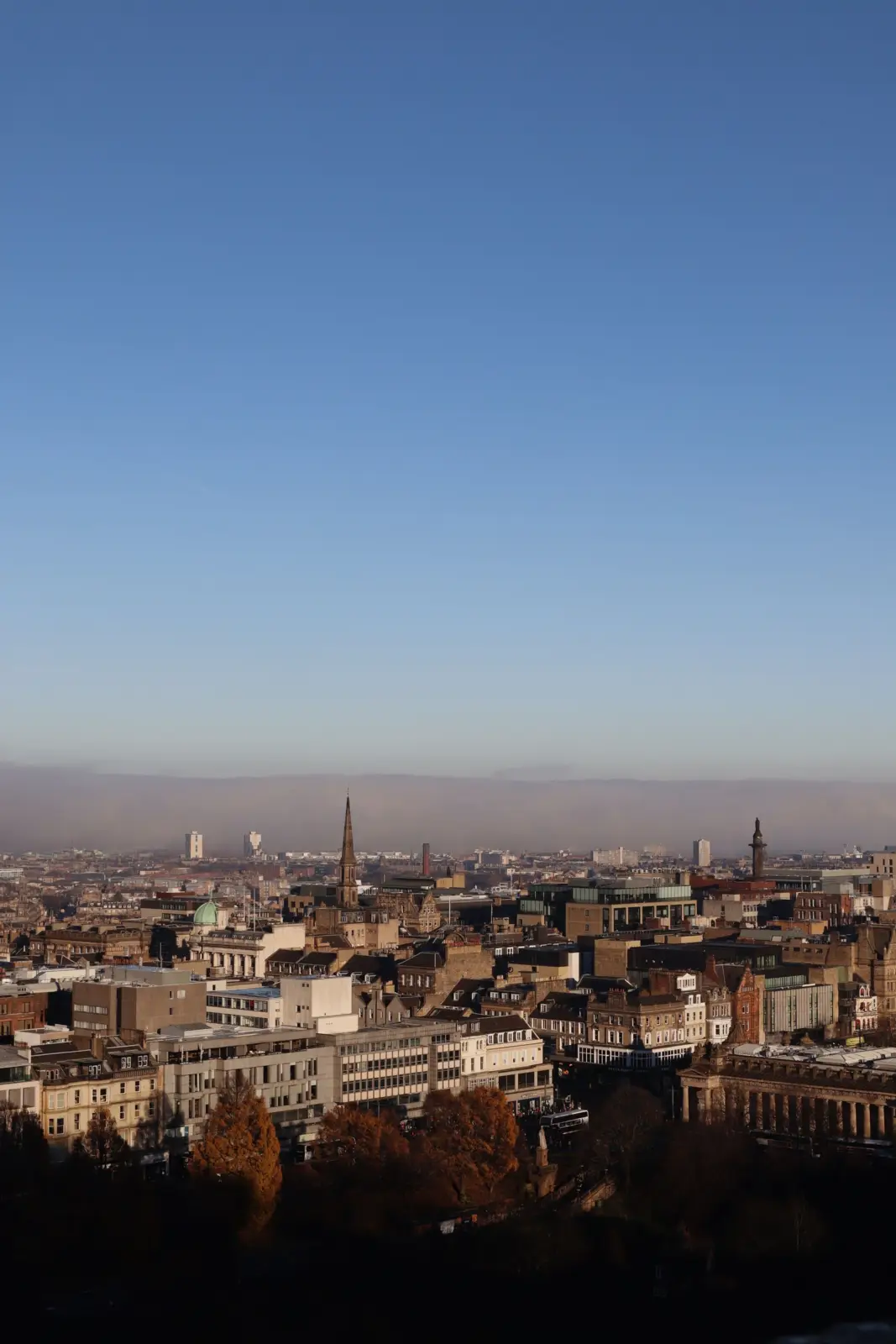 Belfast city centre skyline with church spires and distant hills