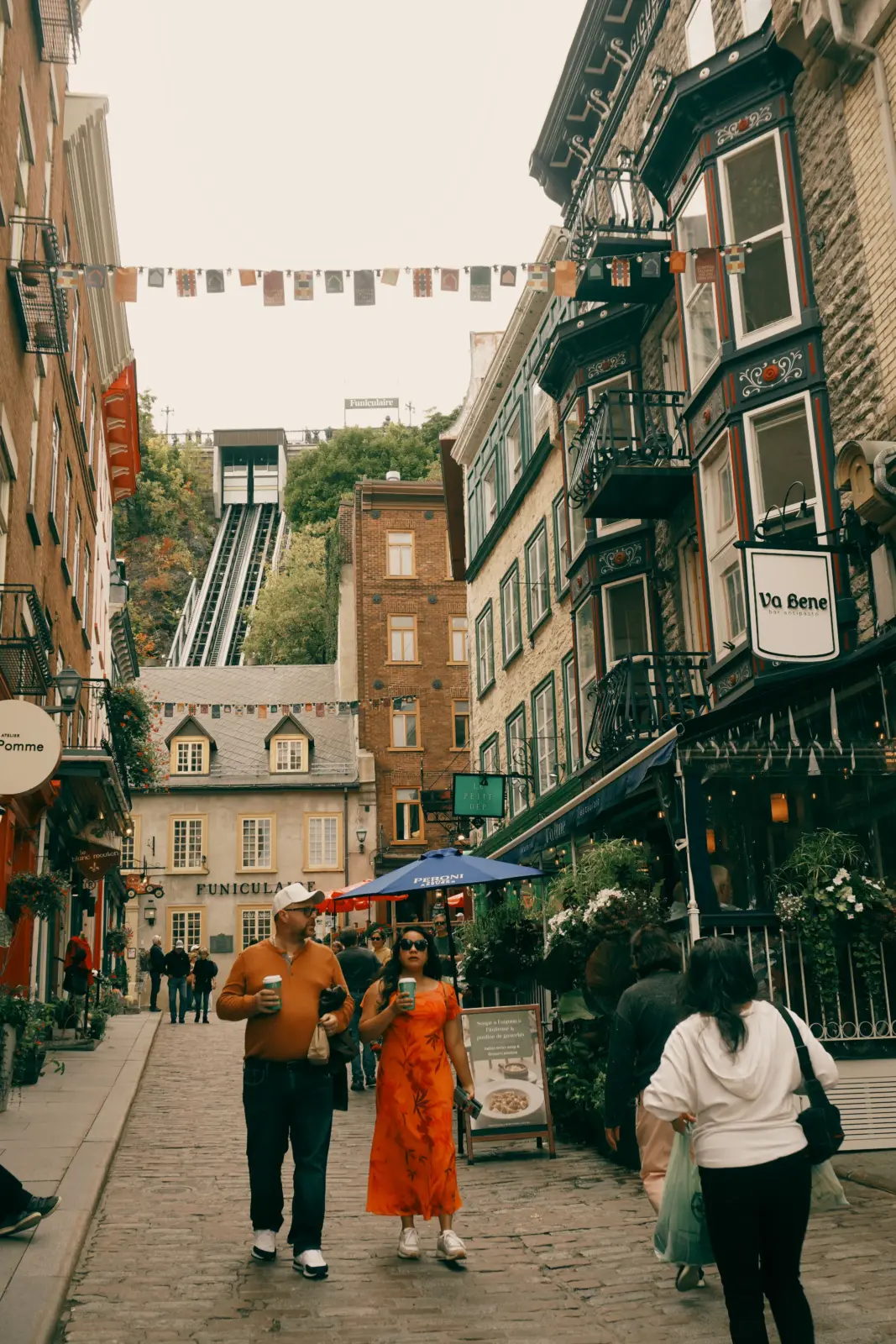 Pedestrians walking below the Old Quebec Funicular in Quebec City