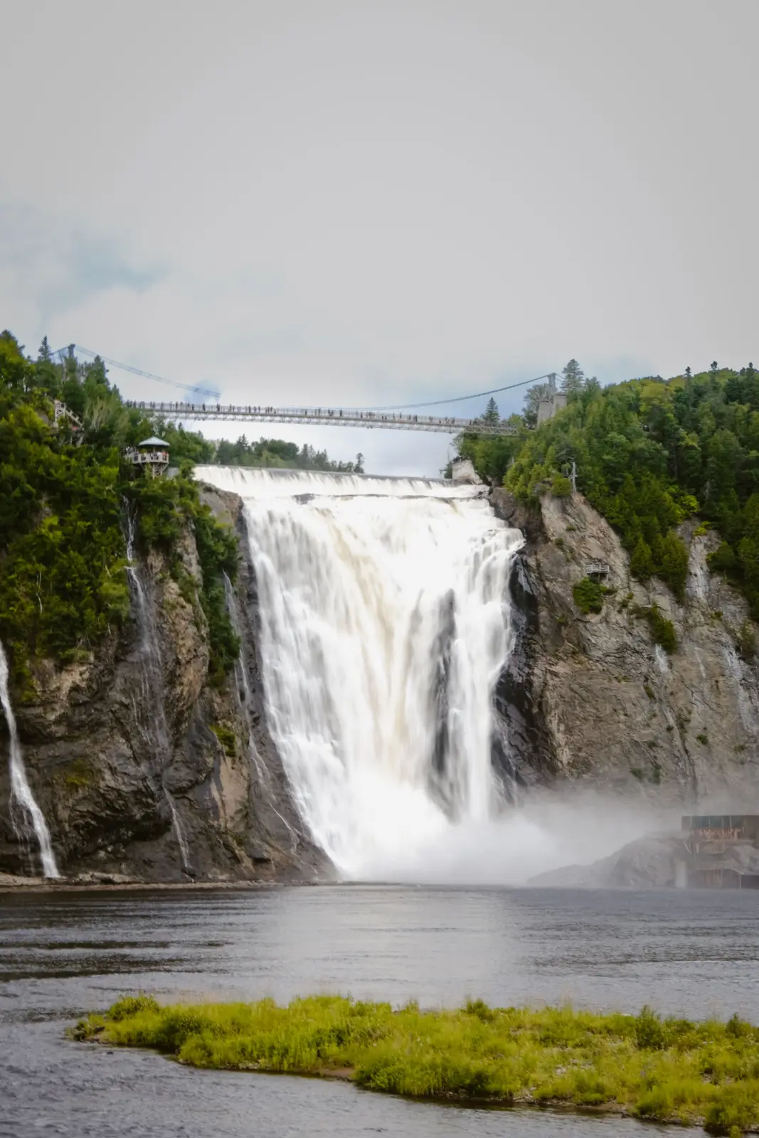 Montmorency Falls cascading beneath the suspension bridge near Quebec City