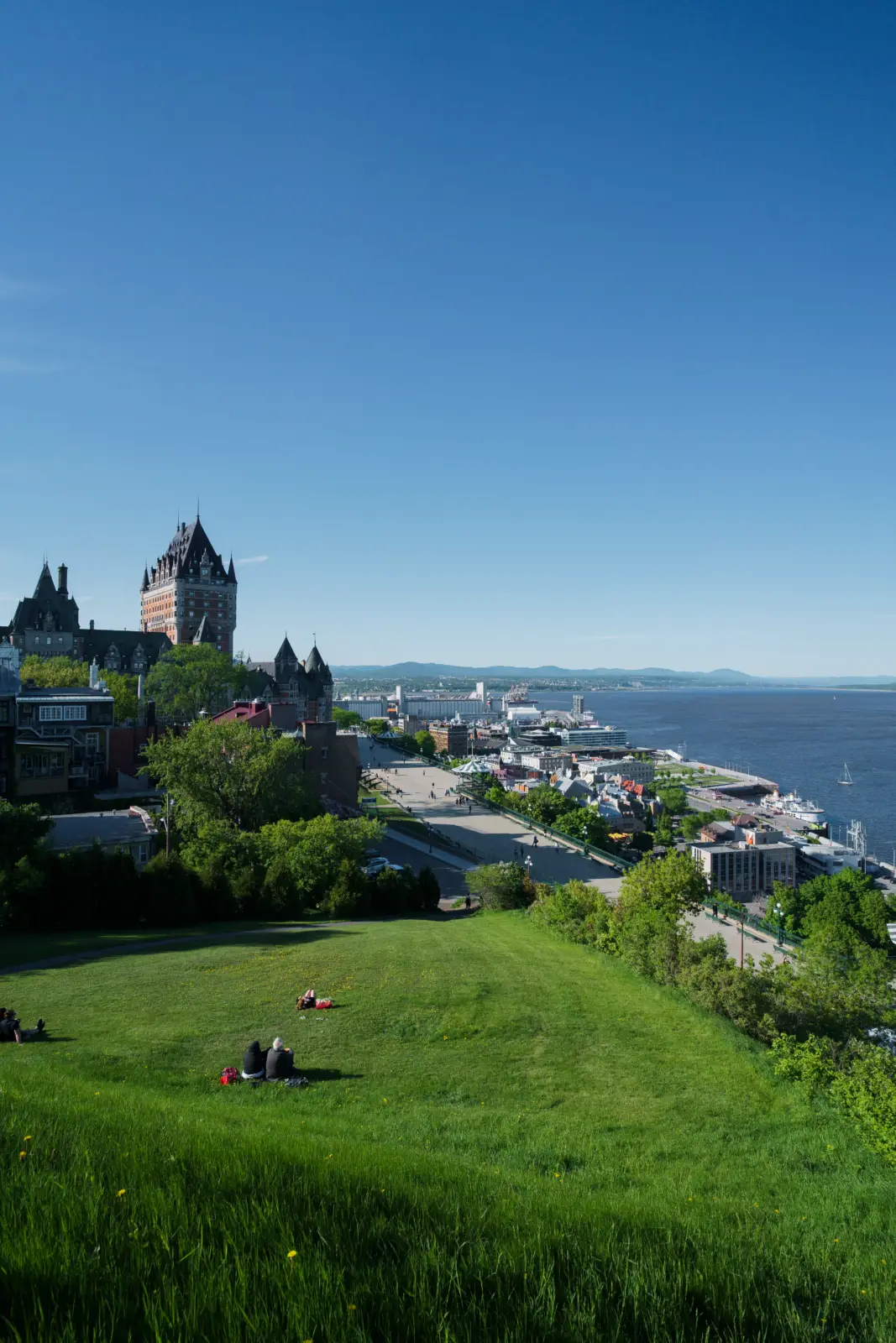 Old Quebec, Château Frontenac and the St. Lawrence River viewed from a grassy hillside