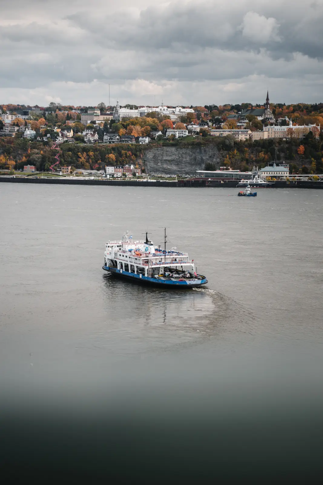 Quebec City–Lévis ferry crossing the St. Lawrence River with the Lévis waterfront behind it