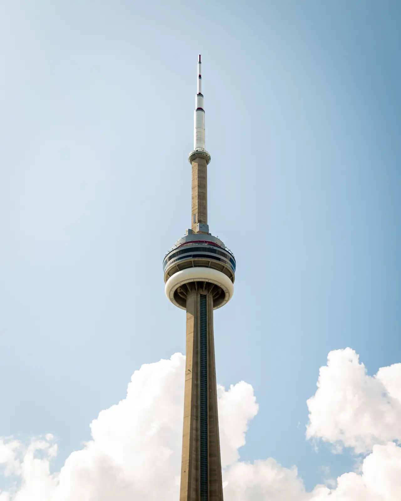 CN Tower rising against a blue sky in Toronto