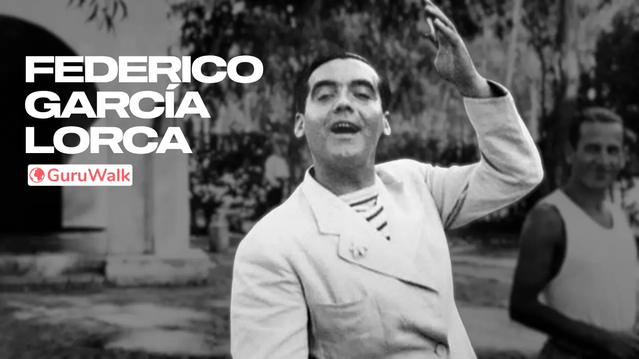 Federico García Lorca sonriendo y saludando con la mano en alto